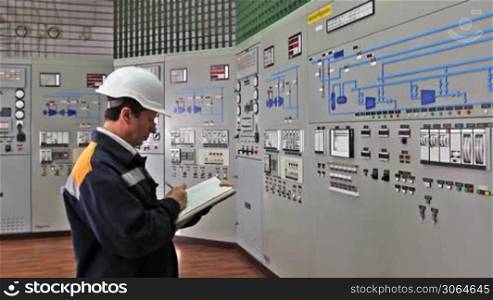 engineer writes technological parameters of control panel in log