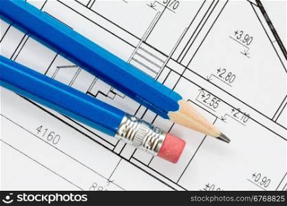 Engineering and architecture drawings with blue pencils
