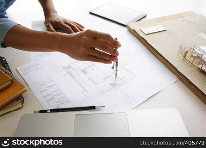 Engineering colleagues interior designer Corporate Achievement Planning Design on blueprint Teamwork Concept with compasses