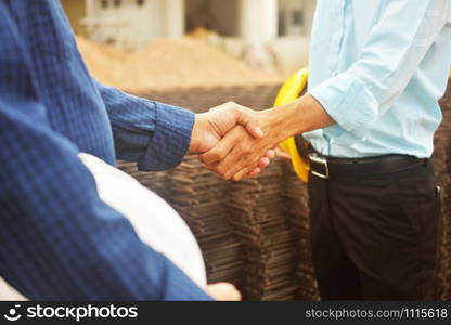 Engineering hands shake at work place building construction estate project success,Business people shake hand agreement investment business