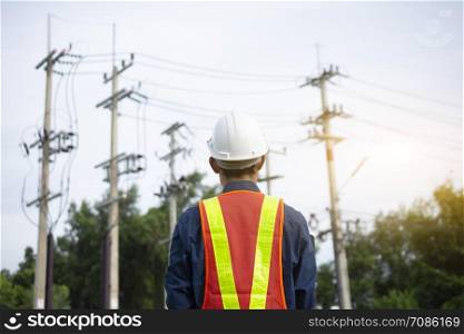 Engineering inspects the wires on the electrical pole.