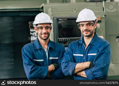 Engineering team portrait smile in heavy industry factory men working together. Arm Crossed fold with space.