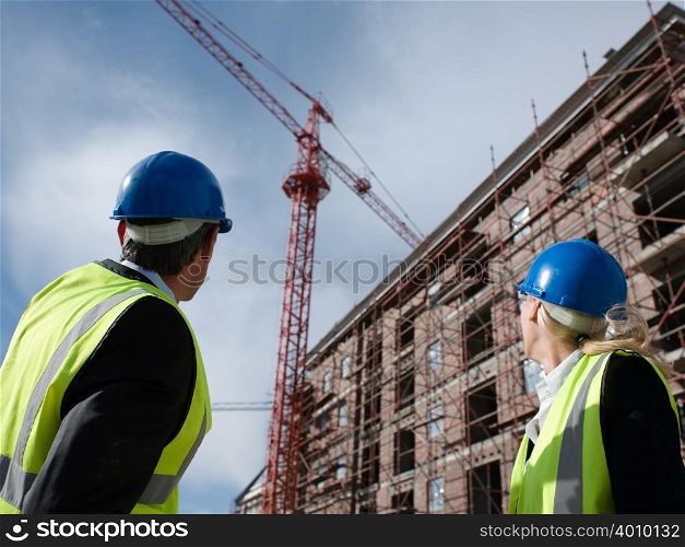 Engineers looking at crane