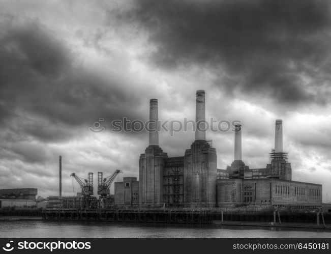 England, London, Battersea. Battersea power station against dark a stormy sky.. Black and white Battersea power station against a dark stormy sky before local develoments changing the iconic skyline