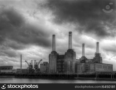 England, London, Battersea. Battersea power station against dark a stormy sky.. Black and white Battersea power station against a dark stormy sky before local develoments changing the iconic skyline