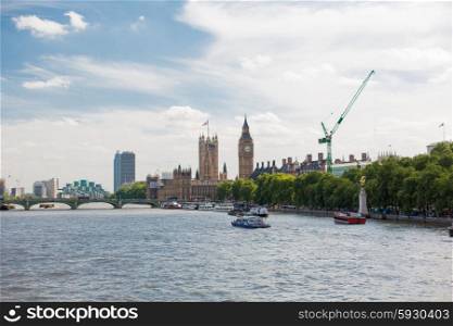 England, London - Big Ben, the Houses of Parliament and Westminster bridge over Thames river