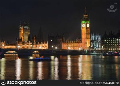 England, London, Houses of Parliament. Houses of Parliament with Big Ben and Westminster Bridge at night in London.. Landscape image of the London skyline at night looking along the River Thames