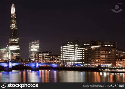 England, London, The Shard. The Shard in London at night with Blackfriars Bridge over the River Thames.. Landscape image of the London skyline at night looking along the River Thames