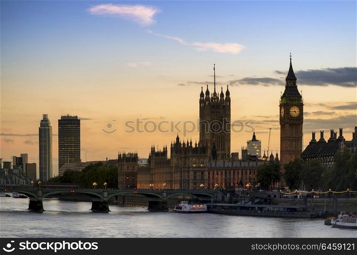 England, London, Westminster. Sunset skyline of Big Ben and Houses of Parliament in London.. Stunning London City skyline landscape at night with glowing city lights and iconic landmark buldings and locations