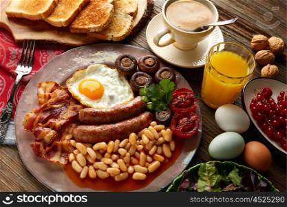 English breakfast with sausages egg beans bacon mushrooms and grilled tomato
