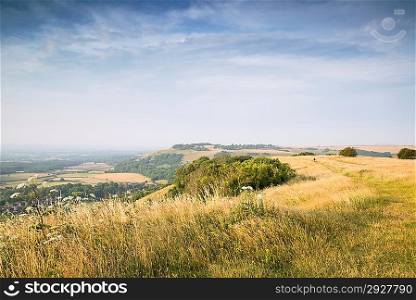 English countryside landscape during late Summer afternoon with dramatic sky and lighting