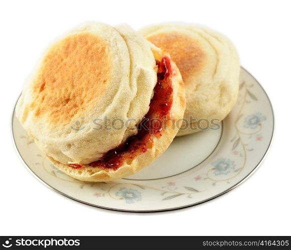 english muffins with jelly on white background