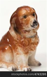 English Shepherd puppy. Ceramic figurine, dog breed isolated on white