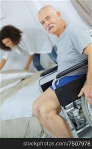 enior man in wheelchair in the retirement house