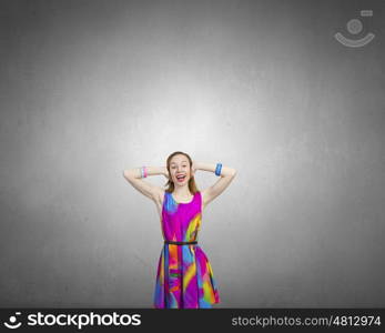 Enjoy silence. Young woman closing her ears with palms and enjoying the silence