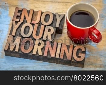 enjoy your morning - word abstract in vintage letterpress wood type printing blocks with cup of coffee