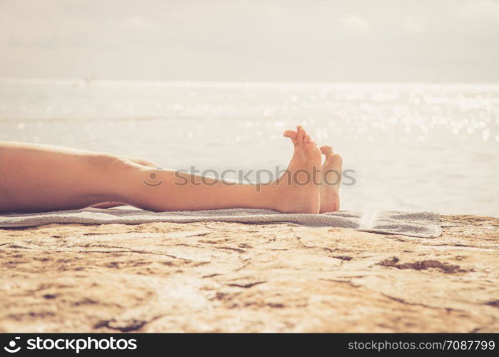 Enjoying the holiday: Legs of a woman in a public bath