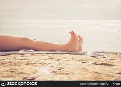 Enjoying the holiday: Legs of a woman in a public bath