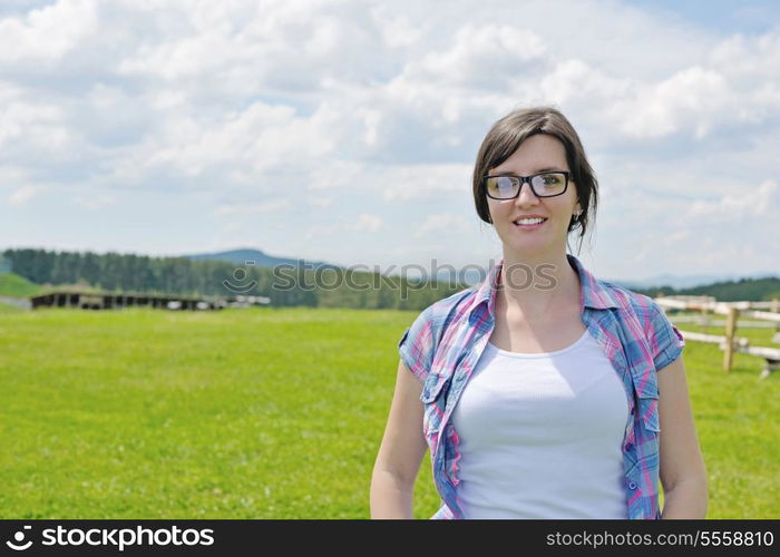 Enjoying the nature and life. Young woman arms raised enjoying the fresh air in green nature