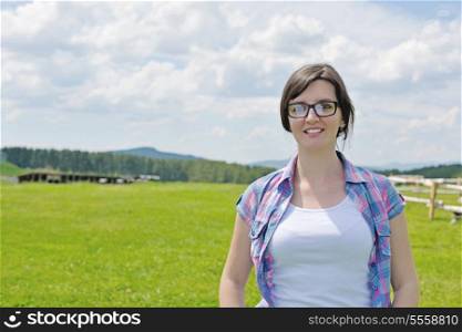 Enjoying the nature and life. Young woman arms raised enjoying the fresh air in green nature