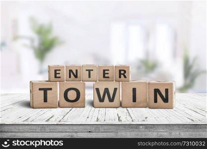 Enter to win sign in a bright room with green plants in the background