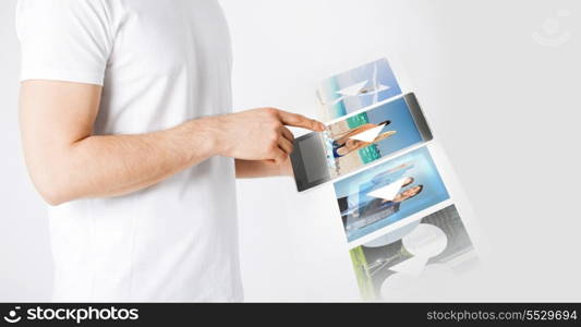 entertainment, future technology and video concept - closeup of man with tablet pc watching video