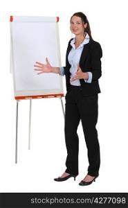 Enthusiastic businesswoman with a flipchart