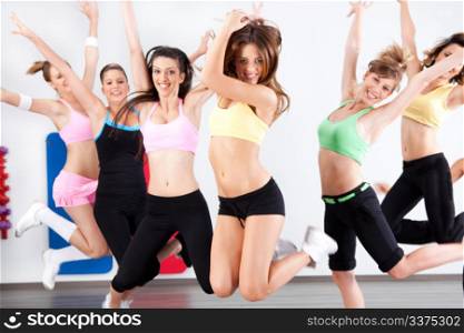 Enthusiastic group of women having fun in aerobics class.