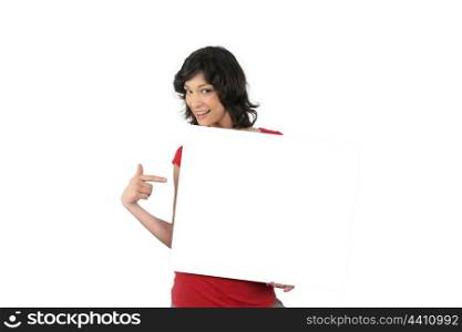 Enthusiastic woman pointing to a blank sign