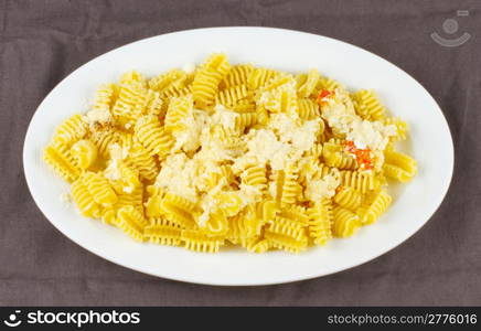 Entire view of a plate of Italian pasta with cheese