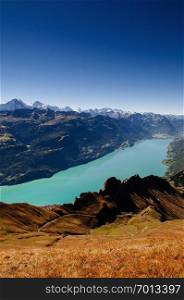 Entlebuch, Switzerland -  Swiss Alps under afternoon sunlight and lake Brienz view from Mount Brienzer Rothorn peak