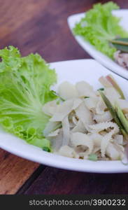 entrails of stomach of beef cooked served with fresh lettuce. ox tripe