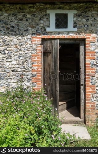 Entrance door to Medieval 18th century flint cottage