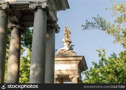 Entrance gate with stone statues in the Parque del Jardin del Principe in Aranjuez, Madrid province, Spain
