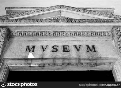 Entrance of an ancient museum, letters on original marble