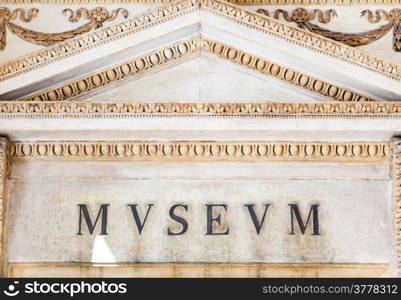 Entrance of an ancient museum, letters on original marble