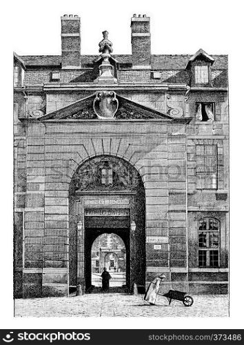Entrance to the courtyard of the Mazarine Library at the Palace of the Institute of France in Paris, France. Vintage engraving.
