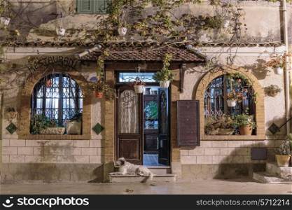 Entrance to the restaurant of the old village house at night, Provence France