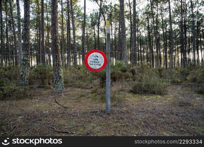 Entry ban sign. Portuguese advise of danger shot do not enter.