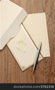 Envelop and blank invitation card with pen