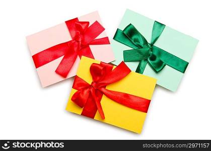 Envelope with colourful ribbon on white