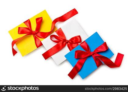 Envelope with colourful ribbon on white
