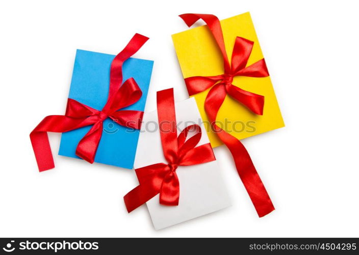 Envelope with colourful ribbon on white