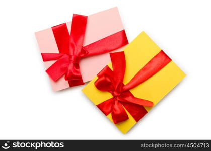 Envelope with colourful ribbon on white