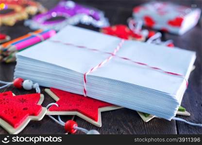 envelopes and christmas decoration on the wooden table