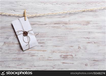 Envelopes on rope. Old envelopes hanging on rope fixed with clothes peg