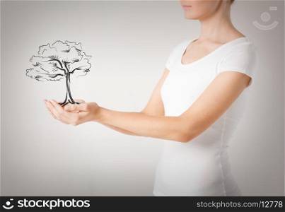 environment, ecology and nature protection concept - woman with small tree in her hands
