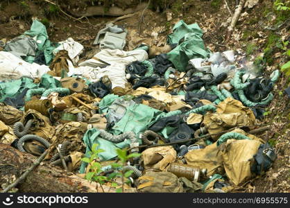 environmental pollution, waste of gas masks and military debris in the woods