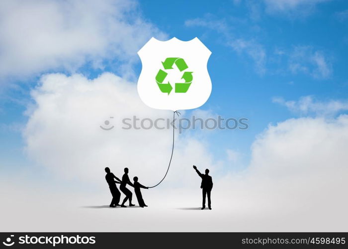Environmental protection. Silhouettes of people pulling balloon with recycle sign