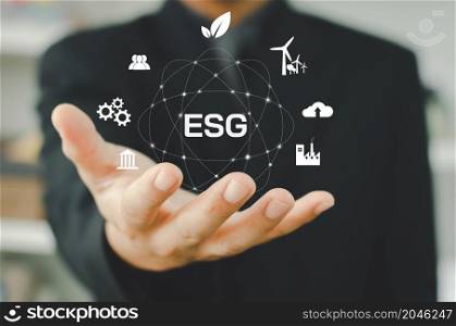 Environmental, social, and governance (ESG) investment Organizational growth that is sustainable is a business idea. man&rsquo;s on icon ESG word on hand a virtual screen.